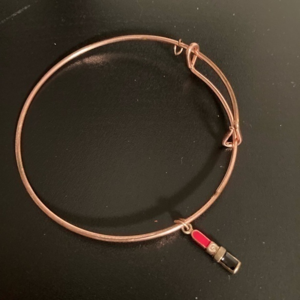 Brass colored bracelet with charm